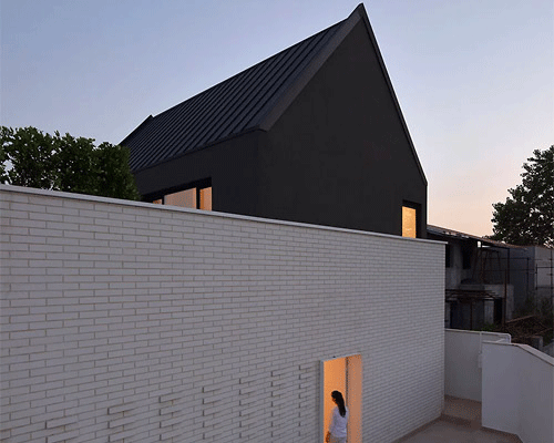 black and white connected volumes shape dwelling by daal studio in iran