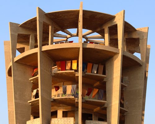 jad el khoury adorns brutalist aquarium in lebanon with colorful beach towels