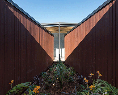 a natural ventilated childcare centre settles within new zealand's countryside