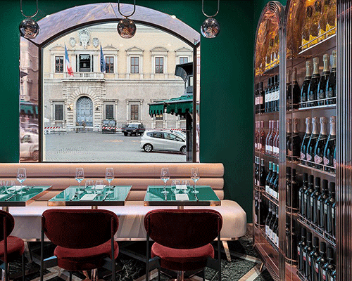 green walls, polychrome marble + velvet furniture decorate 'VyTA farnese' bar in central rome