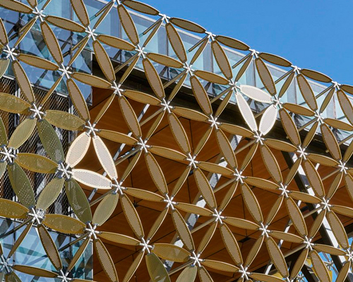 a geometric 'petal' façade clads HASSELL's new student hub for university in australia
