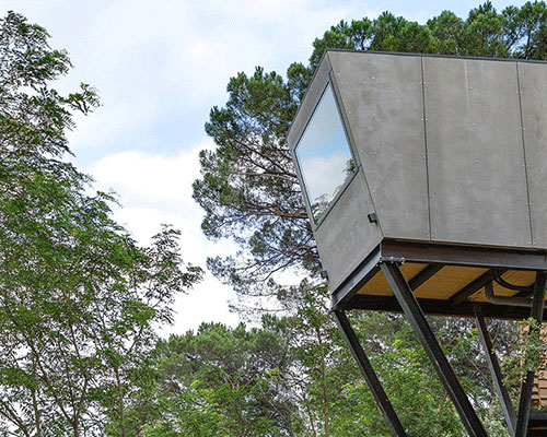 in-tenta design cantilevers prefab tiny hotel suite above spanish natural landscape