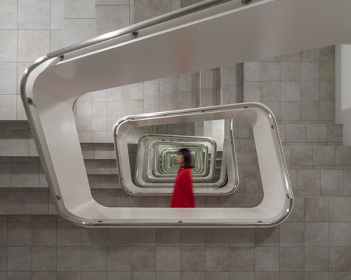 leandro erlich's infinite staircase at japan's KAMU kanazawa seemingly expands space