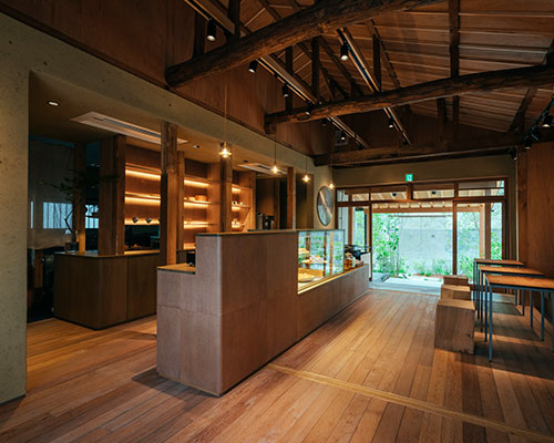 mud walls, solid wood + copper finishes complete restaurant interior by studio suido in osaka