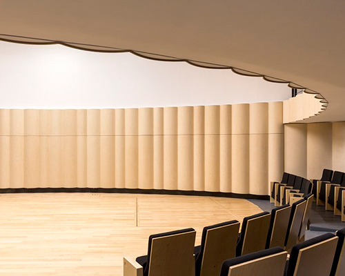 PARC architects restores the auditorium of versailles with waves of blond wood