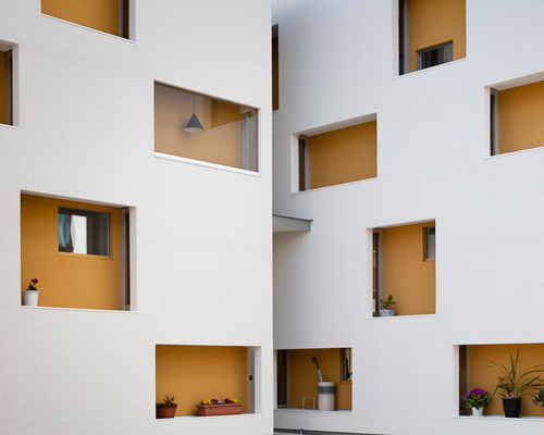 shigeru aoki rotates part of an existing building to create 'double skin house' in japan
