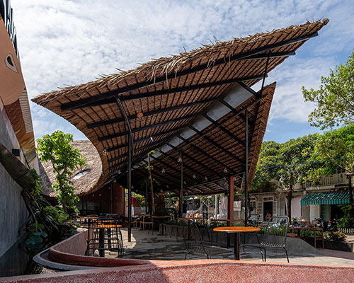 a thatched roof café in mekong river delta by AD+studio reflects 'adrift' local lifestyle