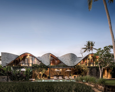 alexis dornier tops 'alpha house' in bali with sculptural, undulating roof