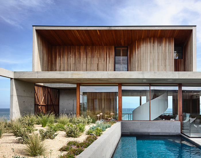 auhaus builds a beachside house around a tiered central courtyard in australia