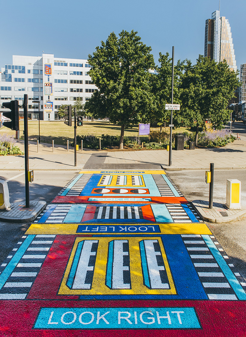 camille walala transforms  london's white city place with colorful geometric patterns