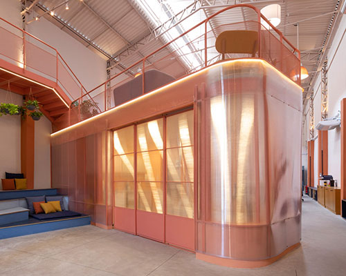 colorful booths + mezzanine balconies form office space for dental health company in brazil