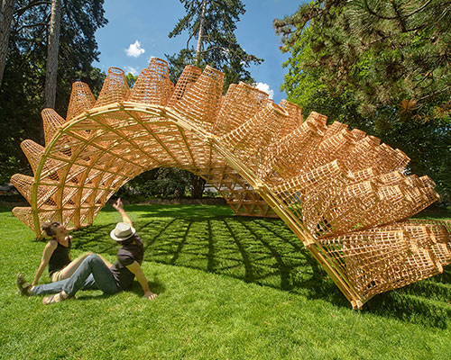 DJA introduces triangular wicker mesh pavilion in france, woven by latvian craftsmen
