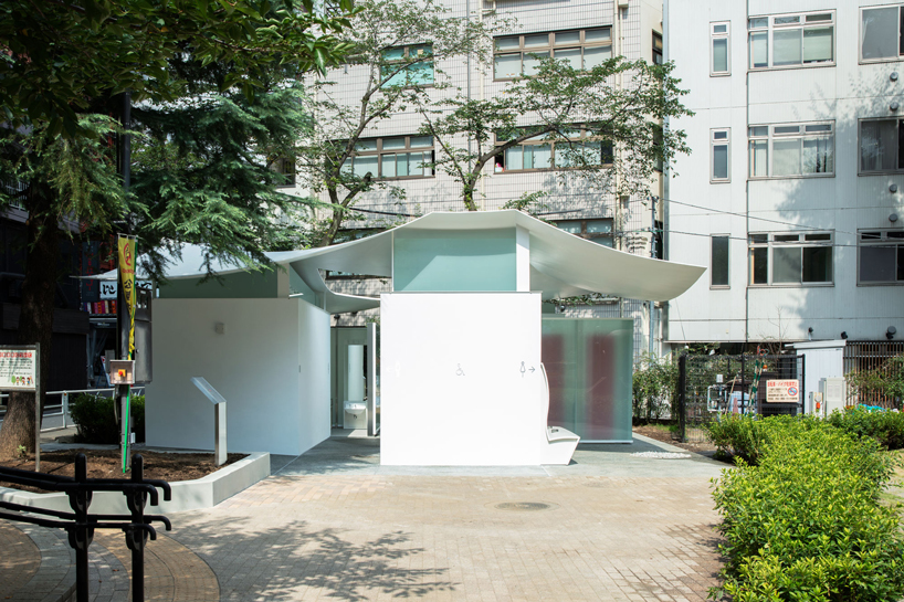 fumihiko maki's tokyo toilet is designed with a courtyard and curved roof designboom