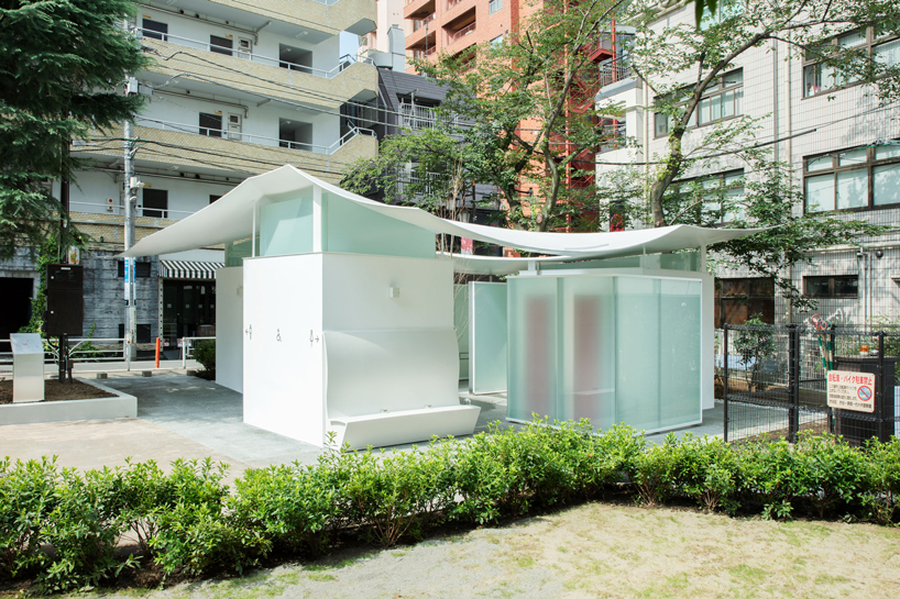 fumihiko maki's tokyo toilet is designed with a courtyard and curved roof designboom