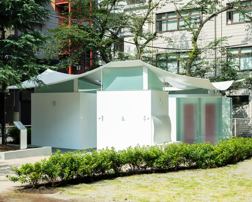 fumihiko maki designs the 'squid toilet' in tokyo with a courtyard and curved roof