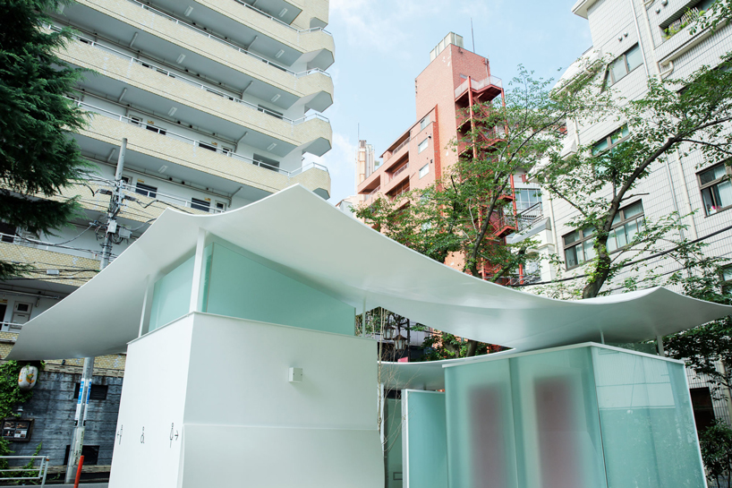 fumihiko maki's tokyo toilet is designed with a courtyard and curved roof designboom