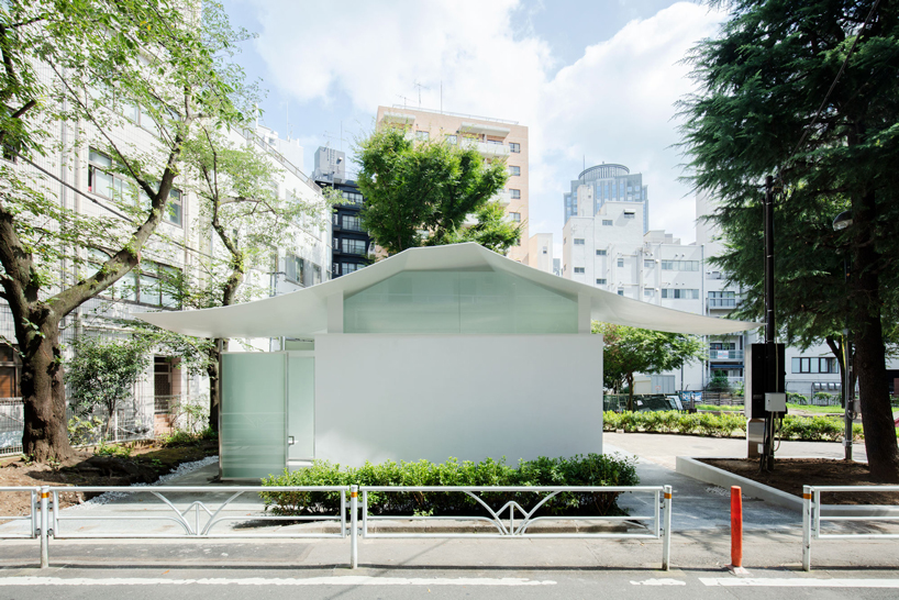 fumihiko maki's tokyo toilet is designed with a courtyard and curved roof designboom