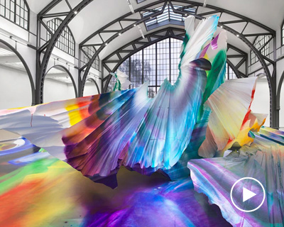 katharina grosse immerses former railway building in explosive kaleidoscopic painting