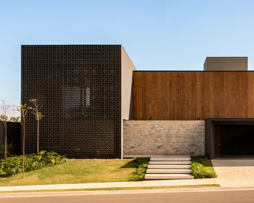 mf+arquitetos applies black cobogó bricks and timber brises to house in brazil