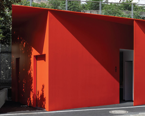 nao tamura designs accessible, all-red restroom as part of 'tokyo toilet' initiative