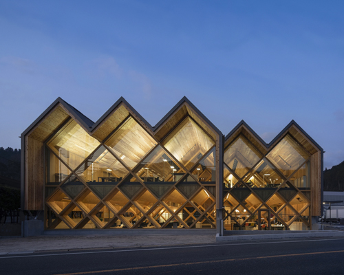 NKS architects uses criss-crossing laminated timber to design an office in japan