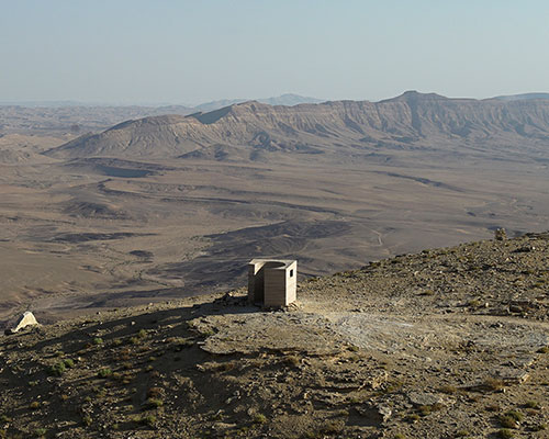 sand + rocks form 'landroom' observatory overlooking world's largest erosion crater in israel