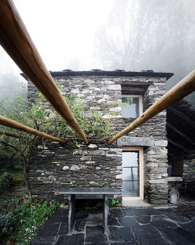 studio inebi renovates 1950's 'calascino' summer house in switzerland - 11