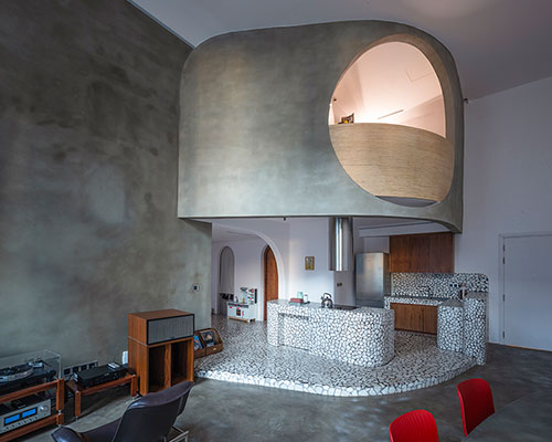 terrazzo sections + curved corners complete modernist apartment interior in vietnam