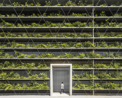 G8A architecture & rollimarchini architekten add green façade to vietnam's jakob factory