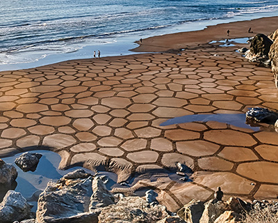 andres amador prints ephemeral sand patterns on beaches around the world