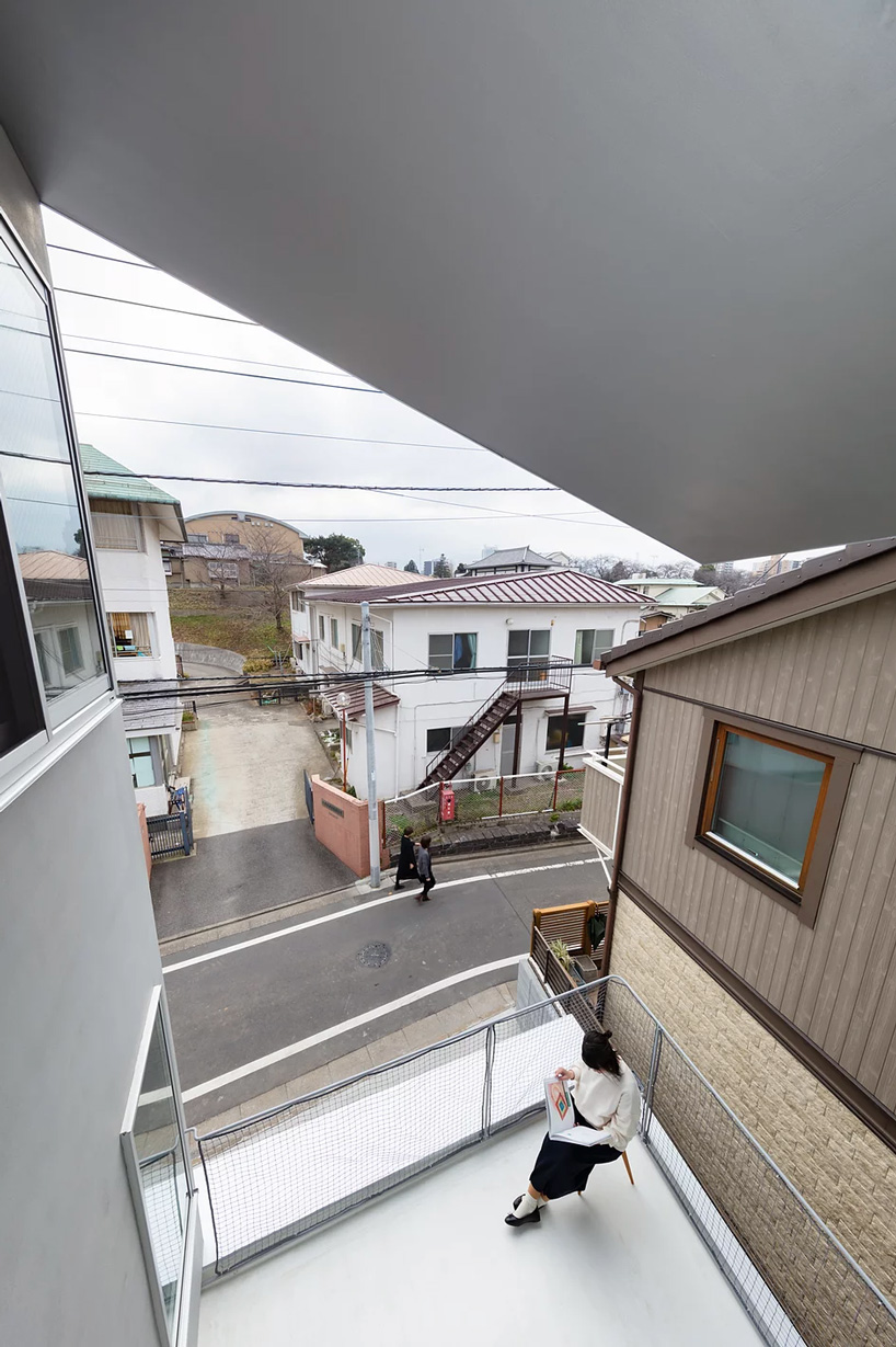 view of the surroundings from the terrace in atelierco architects' 'brass house' in tokyo