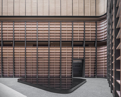 BEHIVE architects designs shanghai hotel around a 7 storey triangular atrium