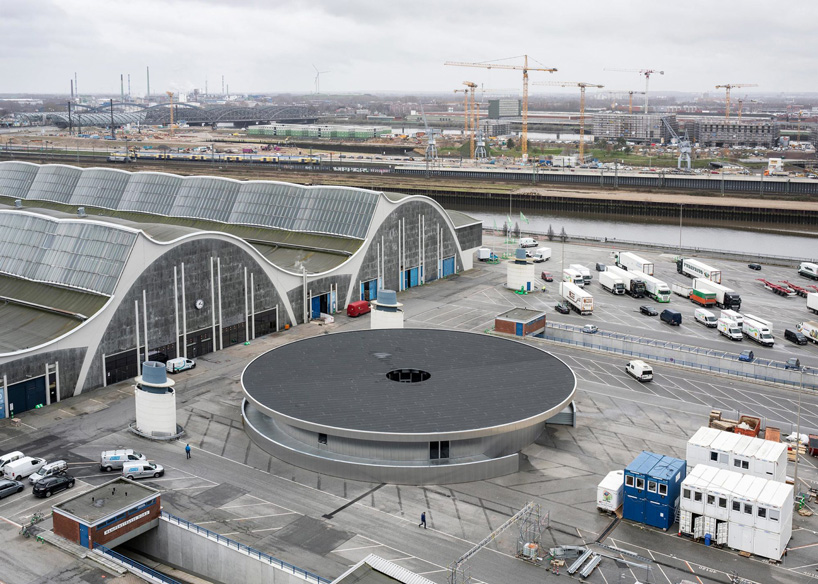 aerial view of carmody groarke's circular aluminum pavilion for temporary theater in hamburg