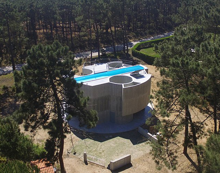 'trefoil house' in portugal by double (o) studio supports a rooftop lap pool