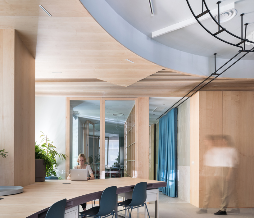 ENORME studio uses movable partitions to create flexible office in madrid designboom