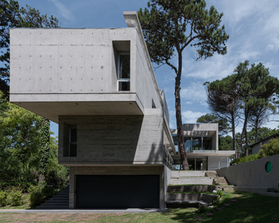 estudio galera's 'casa jacaranda' is a cluster of growing and expanding concrete boxes