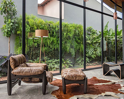 estúdio HAA! builds family house in brazil with large glass openings that bring the garden in