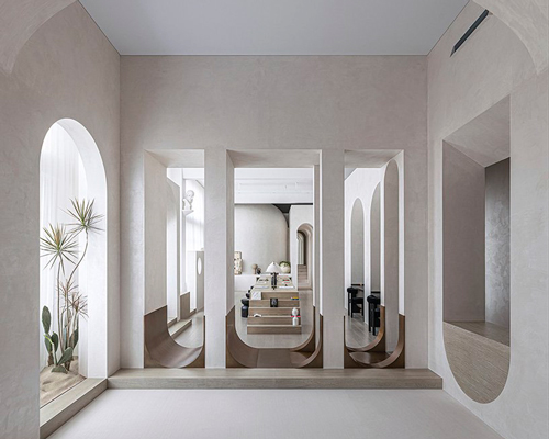 EVD designs own office space in shanghai using soft curves and arch motifs