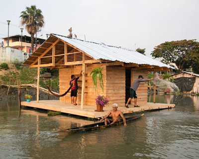fisherman's refuge by natura futura + juan carlos bamba floats on a river in ecuador