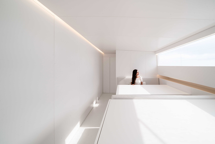 fran silvestre arquitectos redesigns turkish schooner to create all-white sailing vessel - 2