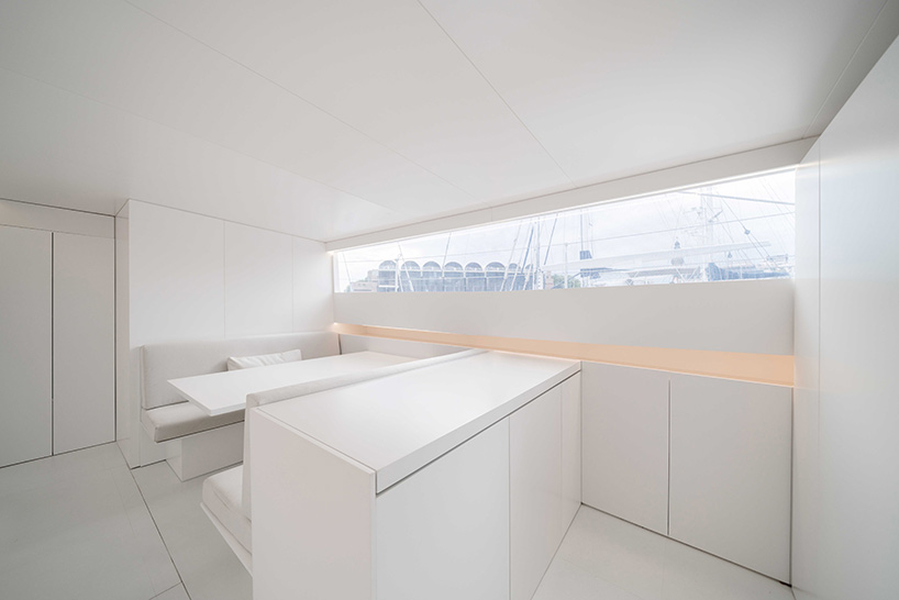 fran silvestre arquitectos redesigns turkish schooner to create all-white sailing vessel - 3