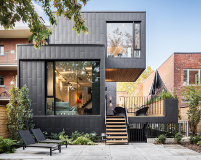 guillaume lévesque adds contemporary townhouse to 1880s duplex restoration in montreal