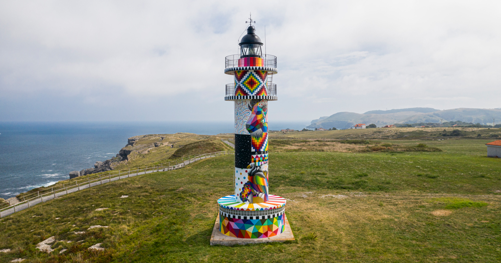 404 error page deisgn example #256: faro lighthouse in spain undergoes a vibrant transformation by okuda san miguel