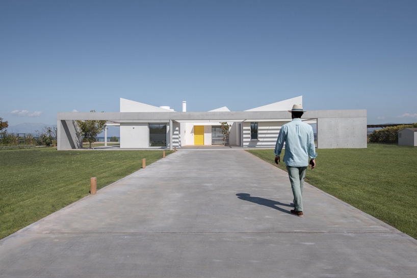 approach from the south to r.c. tech's white monolithic beach house