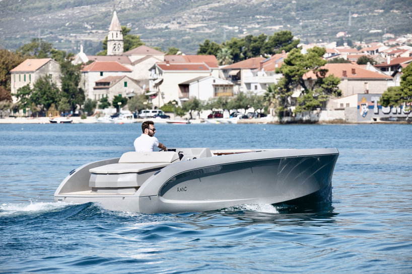 RAND designs the mana 23 electric motorboat as a 'social space on water' designboom