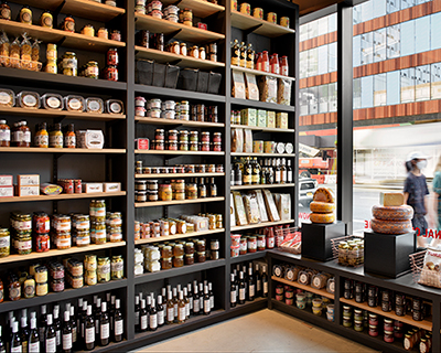 rockwell group designs library-like murray's cheese shop & cheese bar in long island