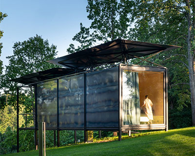 ŠA atelier's modular cabin with rainwater-collecting roof can adapt to any site