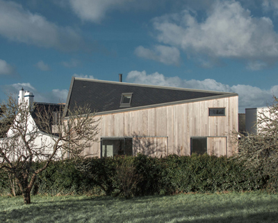 aurelien chen forms his sentinel house with a faceted, three-slope roof