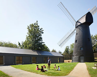 squire and partners build community center adjacent to london's last working windmill