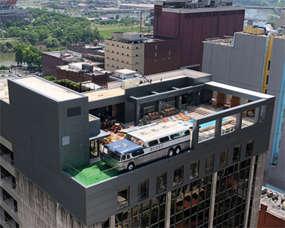 a 1956 greyhound bus settles on the pool lounge rooftop of nashville hotel